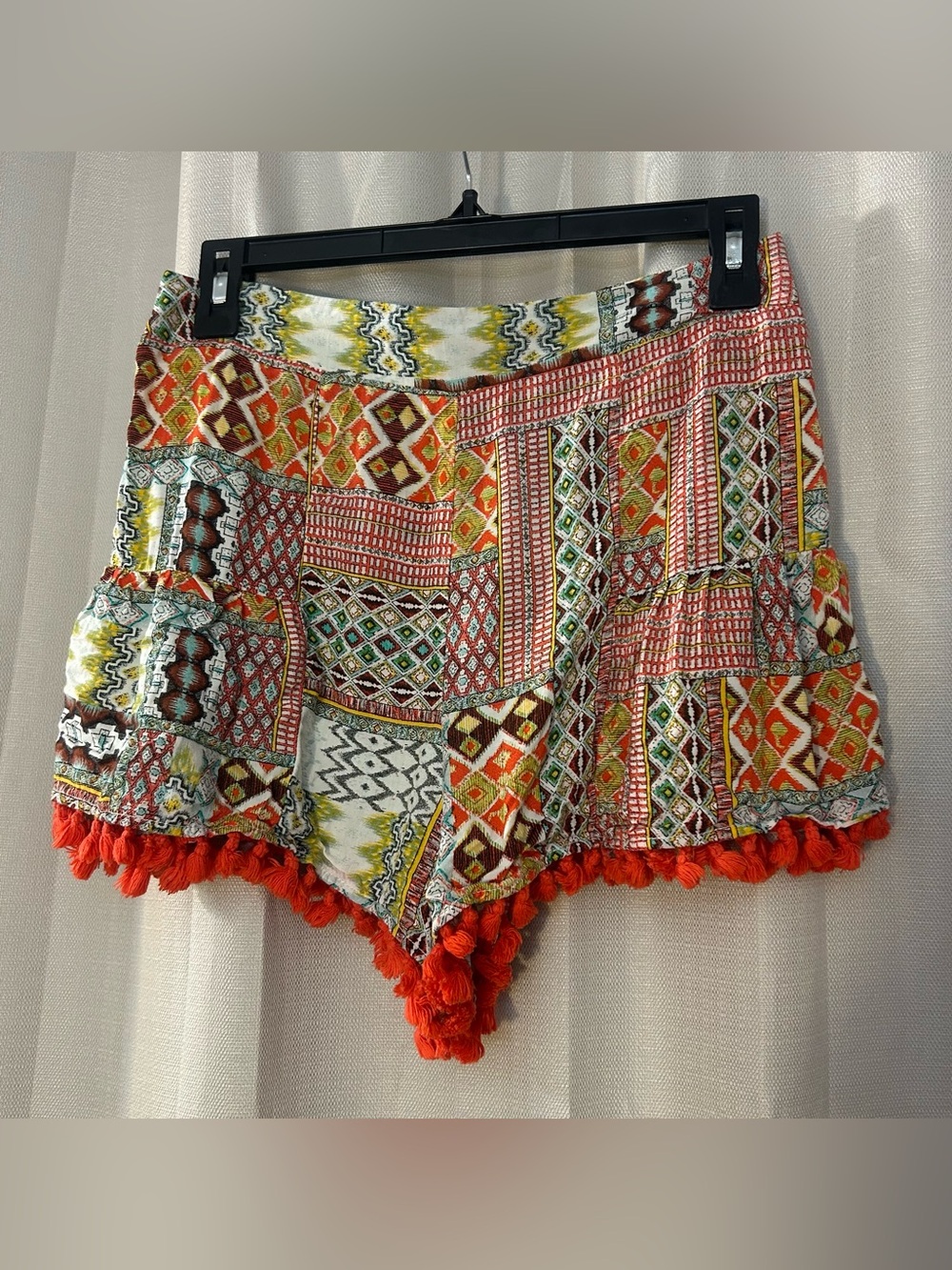 Umgee Boho Geometric Patchwork
Fringe Shorts Orange Tassel S